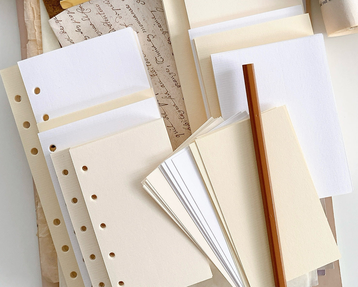 Minimal blank loose leaf planner refill paper in white and warm ivory