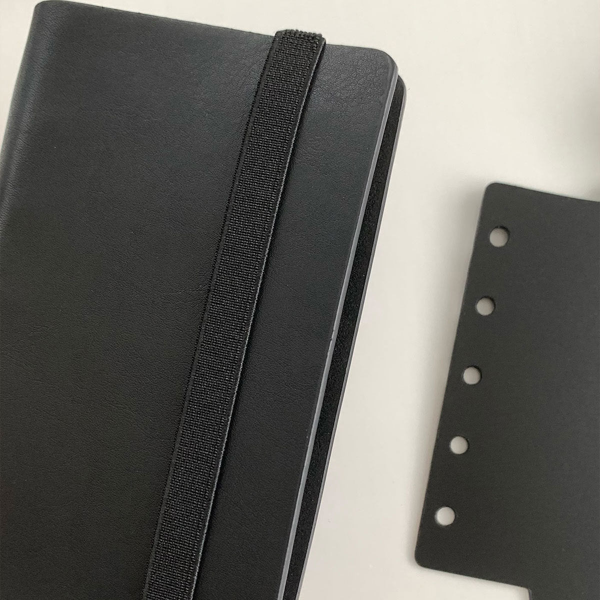 Black M5 planner divider with strap for organizing compact journal sections
